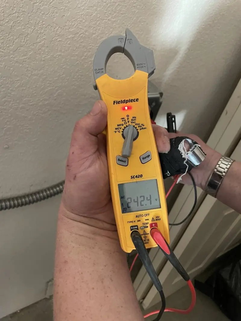 Voltage testing with clamp meter during Electrical Installation Services in Abingdon